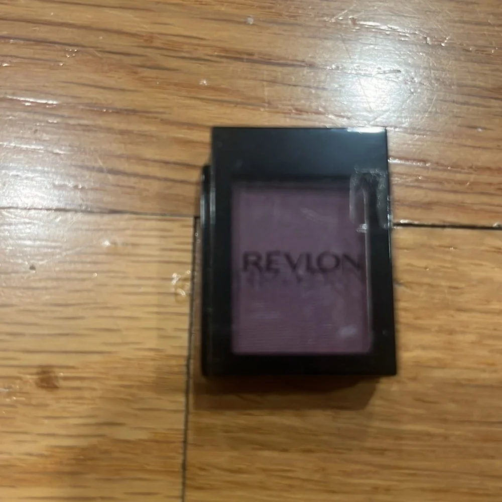 2 Revlon eyeshadows matte plum and metallic copper .